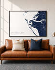 Anna Maria Island canvas map — two-pillow black-frame sofa interior