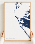 Anna Maria Island canvas map — hands holding the canvas in an oak frame