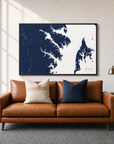 Annapolis canvas map — two-pillow black-frame sofa interior