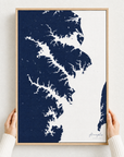 Annapolis canvas map — hands holding the canvas in an oak frame