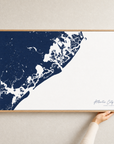 Atlantic City canvas map — hands holding the canvas in an oak frame