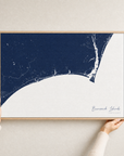 Brunswick Islands canvas map — hands holding the canvas in an oak frame