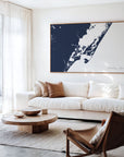 Chincoteague Island navy horizontal canvas map in an oak framed room scene