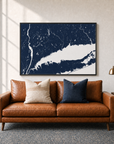 Connecticut Coast canvas map — two-pillow black-frame sofa interior