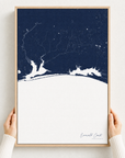 Emerald Coast canvas map — hands holding the canvas in an oak frame