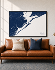 Galveston canvas map — two-pillow black-frame sofa interior