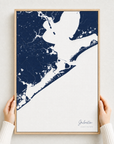 Galveston canvas map — hands holding the canvas in an oak frame