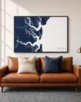 Jekyll Island canvas map — two-pillow black-frame sofa interior
