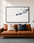 Key West canvas map — two-pillow black-frame sofa interior