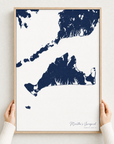 Martha's Vineyard canvas map — hands holding the canvas in an oak frame