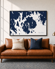 Mount Desert canvas map — two-pillow black-frame sofa interior