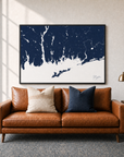 Mystic canvas map — two-pillow black-frame sofa interior
