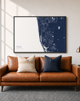 Naples canvas map — two-pillow black-frame sofa interior