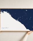 Newport Beach canvas map — hands holding the canvas in an oak frame