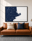North Shore Massachusetts canvas map — two-pillow black-frame sofa interior