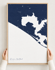 Panama City Beach canvas map — hands holding the canvas in an oak frame