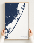 Long Beach Island vertical canvas map in Navy, hands holding an oak-framed canvas