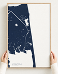 Rehoboth Beach vertical canvas map in Navy, hands holding an oak-framed canvas