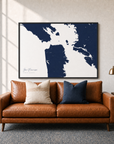San Francisco canvas map — two-pillow black-frame sofa interior