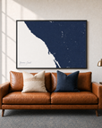 Sonoma Coast canvas map — two-pillow black-frame sofa interior