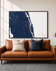 St. Augustine canvas map — two-pillow black-frame sofa interior