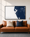 Tampa Bay / Sarasota canvas map — two-pillow black-frame sofa interior