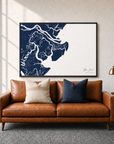 Tybee Island canvas map — two-pillow black-frame sofa interior