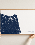 Virginia Beach canvas map — hands holding the canvas in an oak frame
