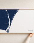 Wilmington canvas map — hands holding the canvas in an oak frame