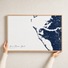 Anna Maria Island canvas map — hands holding the canvas in an oak frame