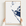 Anna Maria Island canvas map — hands holding the canvas in an oak frame