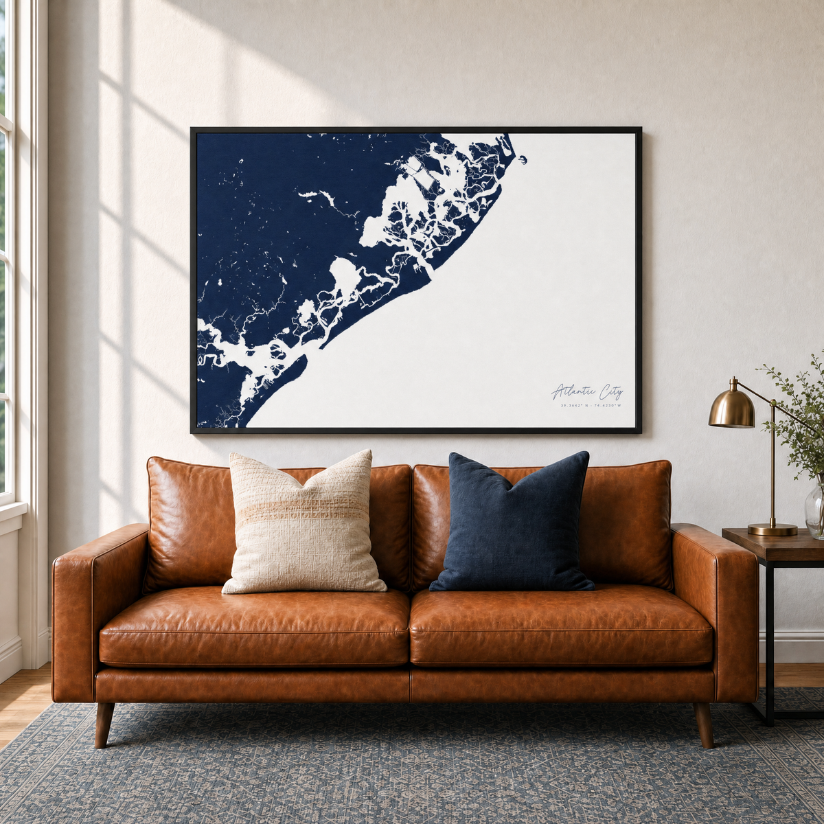 Atlantic City canvas map — two-pillow black-frame sofa interior