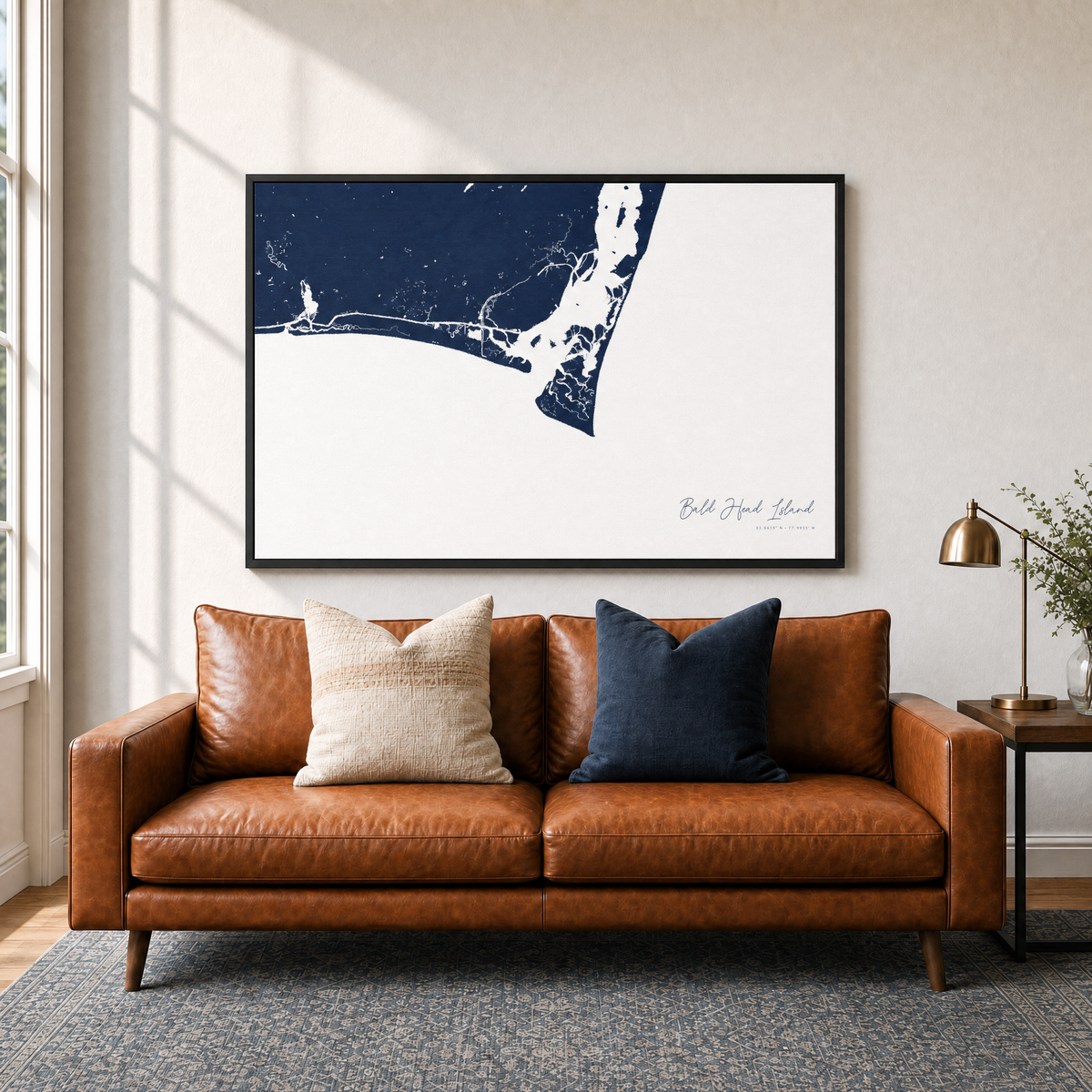 Bald Head Island canvas map — two-pillow black-frame sofa interior