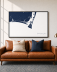 Bald Head Island canvas map — two-pillow black-frame sofa interior