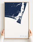 Bald Head Island canvas map — hands holding the canvas in an oak frame
