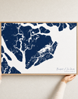 Beaufort / Sea Islands canvas map — hands holding the canvas in an oak frame