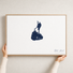 Block Island canvas map — hands holding the canvas in an oak frame