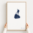 Block Island canvas map — hands holding the canvas in an oak frame