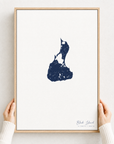 Block Island canvas map — hands holding the canvas in an oak frame