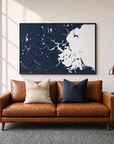 Boston canvas map — two-pillow black-frame sofa interior