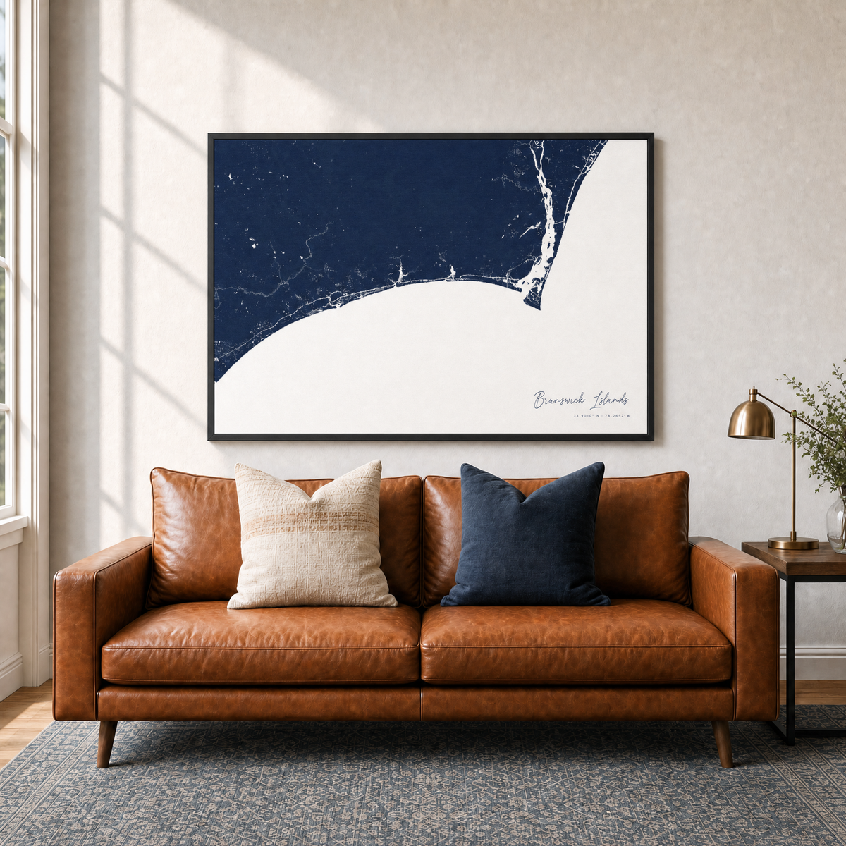 Brunswick Islands canvas map — two-pillow black-frame sofa interior