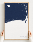 Brunswick Islands canvas map — hands holding the canvas in an oak frame