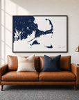 Cape Cod canvas map — two-pillow black-frame sofa interior