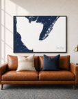 Cape May canvas map — two-pillow black-frame sofa interior
