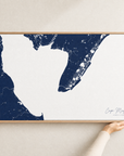 Cape May canvas map — hands holding the canvas in an oak frame
