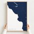 Central California Coast canvas map — hands holding the canvas in an oak frame