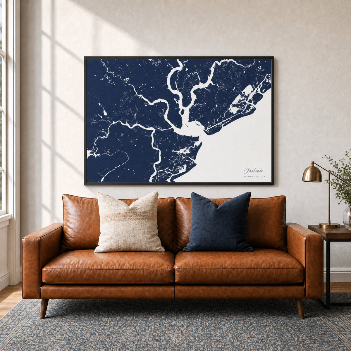 Charleston canvas map — two-pillow black-frame sofa interior