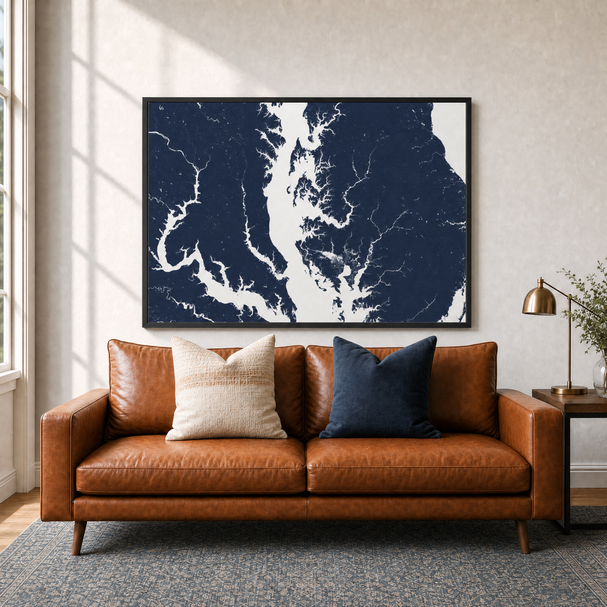 Chesapeake Bay / Maryland canvas map — two-pillow black-frame sofa interior