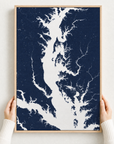 Chesapeake Bay / Maryland canvas map — hands holding the canvas in an oak frame