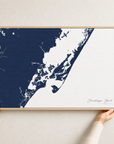 Chincoteague Island canvas map — hands holding the canvas in an oak frame